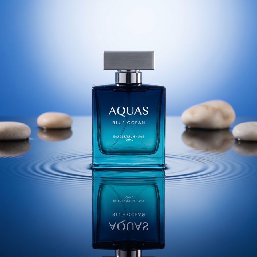 Aquas Blue Ocean pebble still life — beverage marketing visual